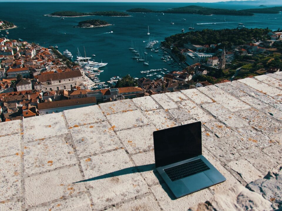 aerial view of city buildings near body of water during daytime